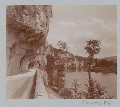 Rock-hewn road along a river in France