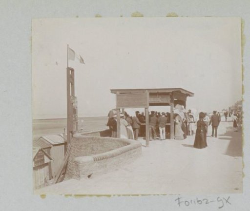 People at a Kiosk by the Sea in France