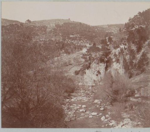 Mountain landscape with a stream, presumably in Southern France