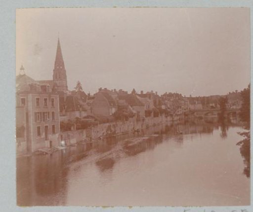 View of a probably French town on a body of water
