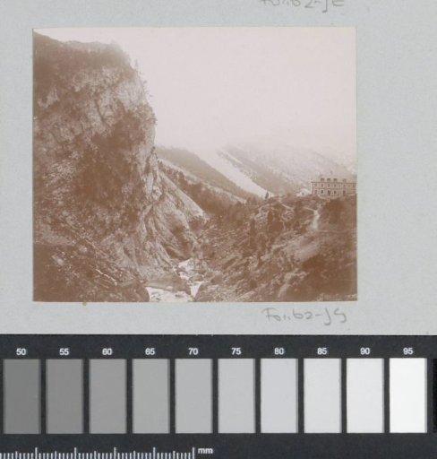 Mountain landscape with a house on a summit, probably in the Pyrenees