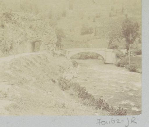 Stone bridge over a stream, probably in the Pyrenees