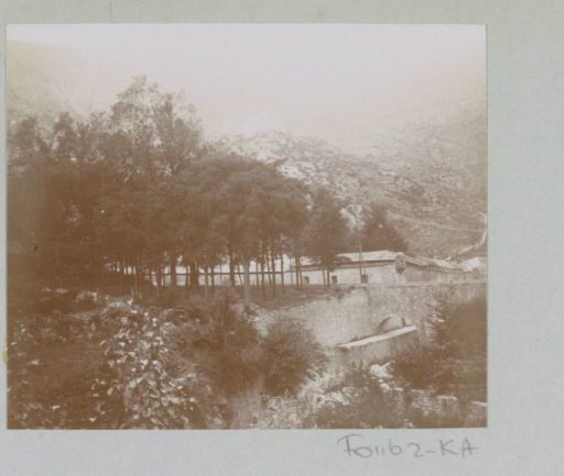 View of a building at the foot of a mountain, probably in the Pyrenees