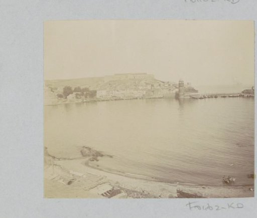View of a city with a tower on a bay, probably in France