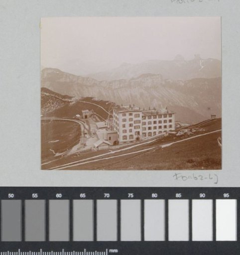 Mountain landscape with the Grand Hotel Rochers de Naye, railway and paths in the Swiss Alps