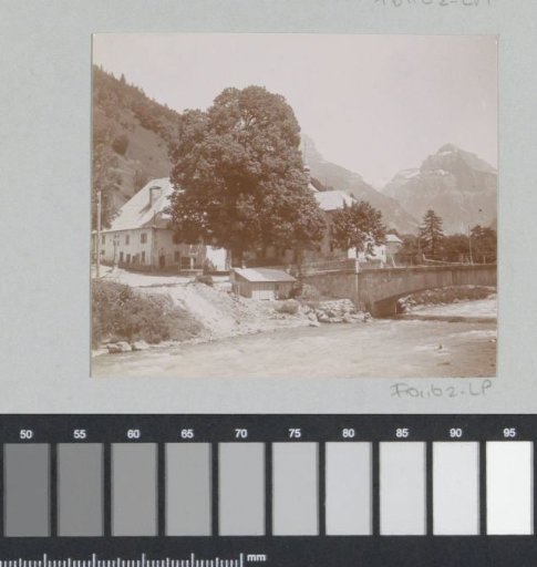 View of Sixt-Fer-à-Cheval with a bridge over the Giffre and the Hôtel du Fer à Cheval on the left