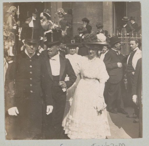 Wedding guests leaving a building, probably in Italy or France