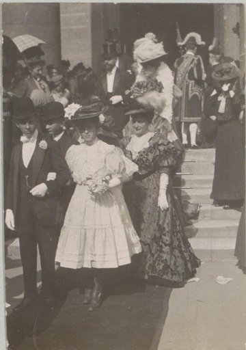 Wedding guests leaving a building, probably in Italy or France