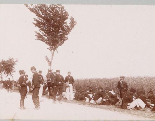 Resting soldiers along a road in France