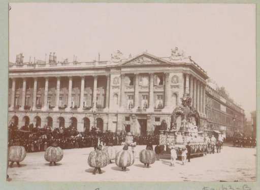 Procession with a triumphal carriage during Mardi Gras on a square in Paris