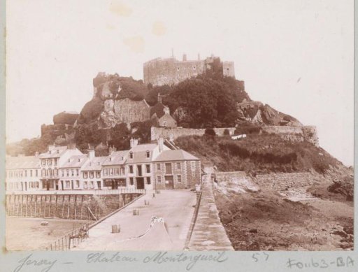 View of the Château de Mont-Orgueil (Gorey Castle) on Jersey with a row of houses in the foreground