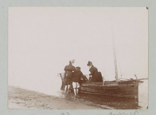 Woman being lifted into a sailing boat, probably off the coast of Le Moulleau near Arcachon