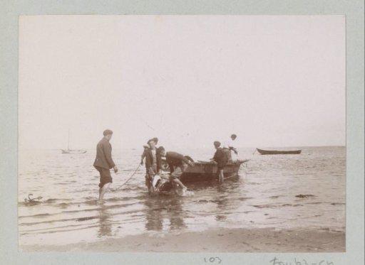 Fishermen bringing a rowing boat ashore, probably near Arcachon