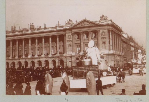 Procession with triumphal carriages during Mardi Gras on a square in Paris