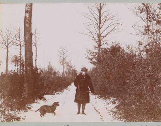 Hunter with dog on a snow-covered path, probably near Arcachon