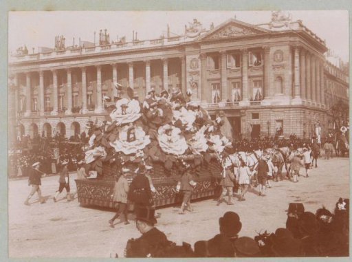 Procession with a triumphal carriage during Mardi Gras on a square in Paris