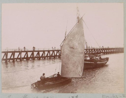 Sailing boats at a pier in Granville