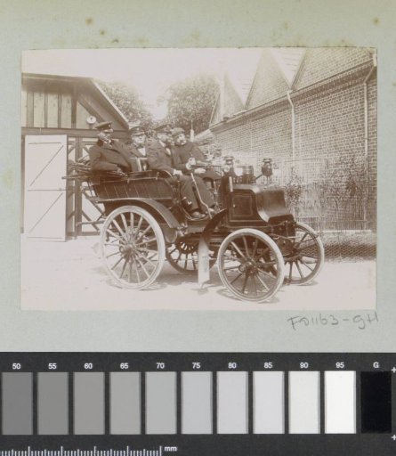Group in an automobile, presumably in Lisieux