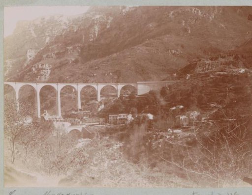 View of a mountain village and a viaduct, probably in southern France between Nice and Magagnosc