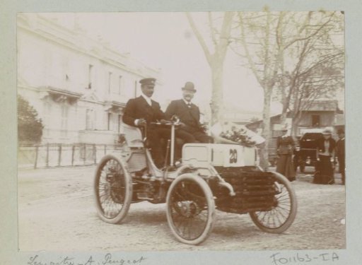Lemaître and A. Peugeot in a motor car, presumably at the Course du Mille, a race in Nice