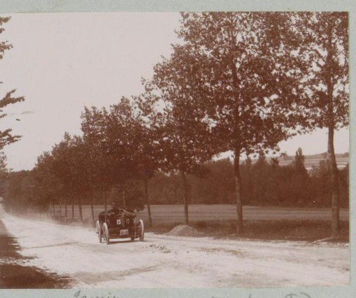Race car driver Jamin, participant in the Tour de France for motor cars, on a country road in Vitry-le-François