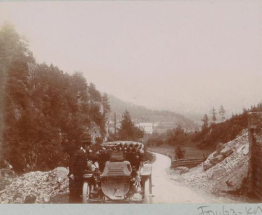 Man by an automobile, presumably near the Inn