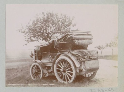 Automobile in the ditch of a road, presumably near Bar-le-Duc