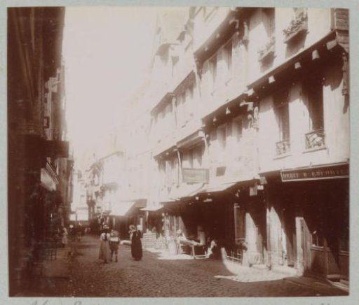 Street in Morlaix with shops and passersby