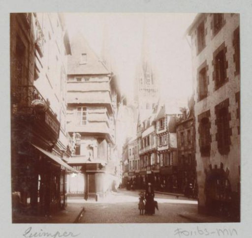 Street in Quimper, with the Cathedral of Saint-Corentin in the Background