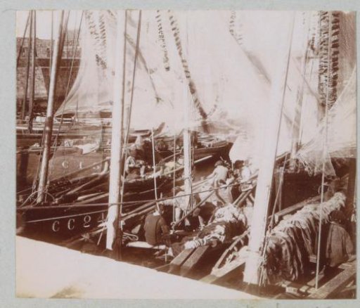 Fishing boats and fishermen in the harbor of Concarneau
