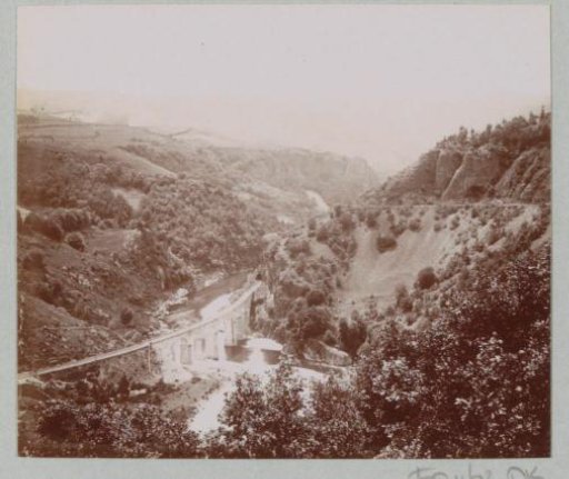 View of a mountain valley with river and a viaduct, probably in the Auvergne