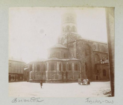 Basilica of Saint-Julian in Brioude with a horse-drawn cart in front