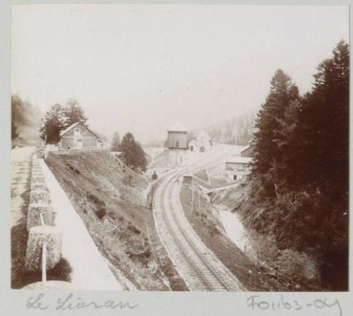View of a railway with station and water tower in Le Lioran
