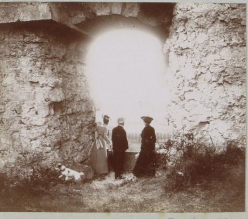 Two women and a man at the ruins of the Château de Coucy