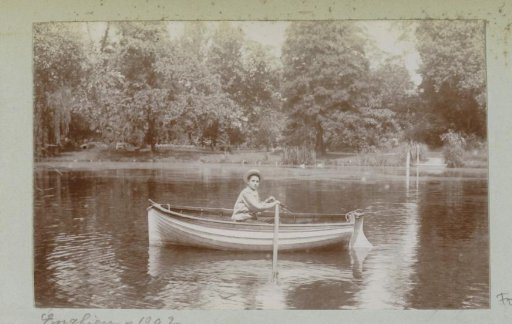Boy in a rowing boat on a waterway in Enghien