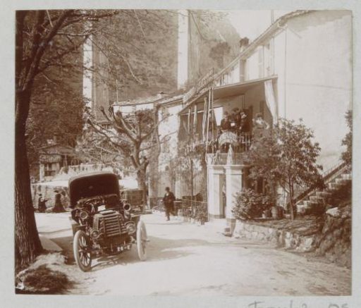 Street Scene with Automobile in Pont du Loup, with a Group at a Hotel on the Right