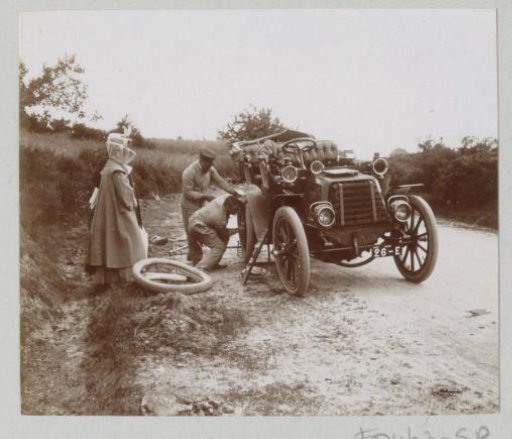 Car tire change on a country road, probably in the Auvergne
