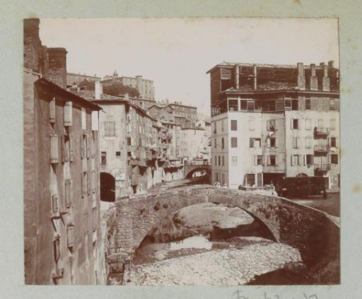 Bridges over a dried-up riverbed and houses in Annonay