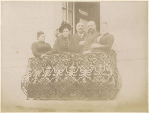 Group portrait of a French family on the balcony of a house