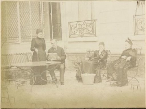 Three women and a man in a garden in France