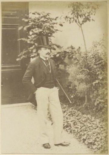 Portrait of a French man with a tall hat, a walking stick and a cigar, standing