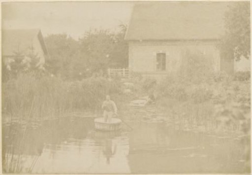 Man rowing in a tub in a pond in France