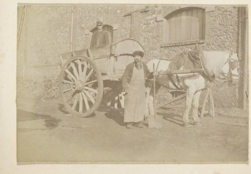 Two men with a horse-drawn cart in France