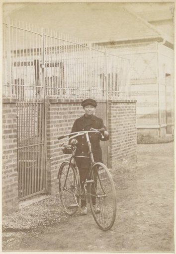 Portrait of a French girl standing next to a bicycle