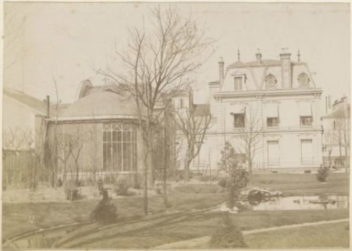 View of a villa with garden and greenhouse in France