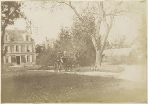 Carriage in a garden with a villa in France