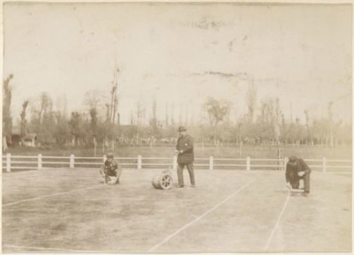 Group preparing a tennis court for use in France