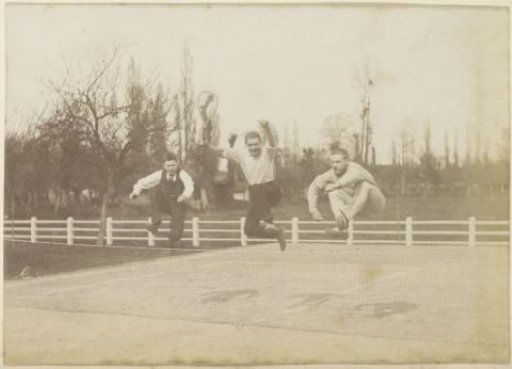 Three French men jumping over a tennis net