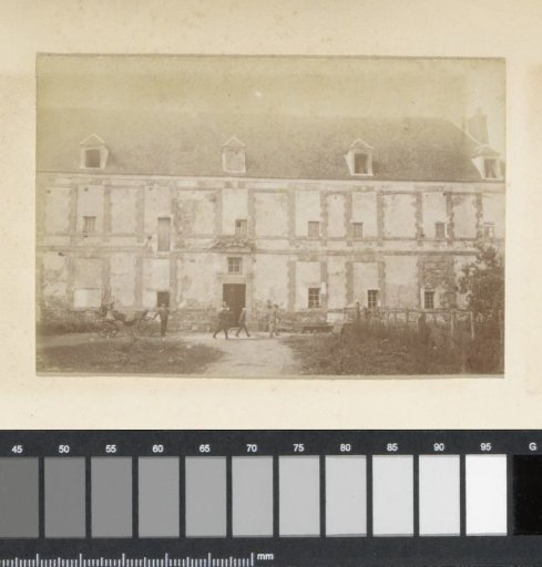 Facade of a country house with bricked-up windows in France