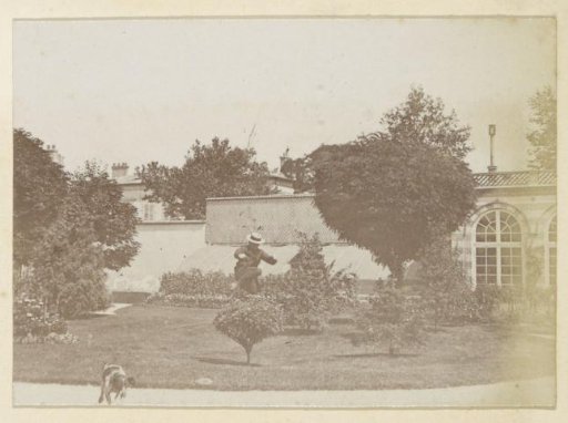 Man jumping over a bush in a garden in France